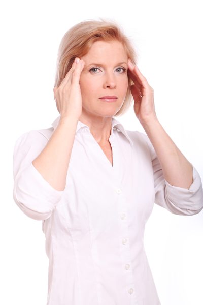 middle-aged-woman-having-head-pain-over-white-background